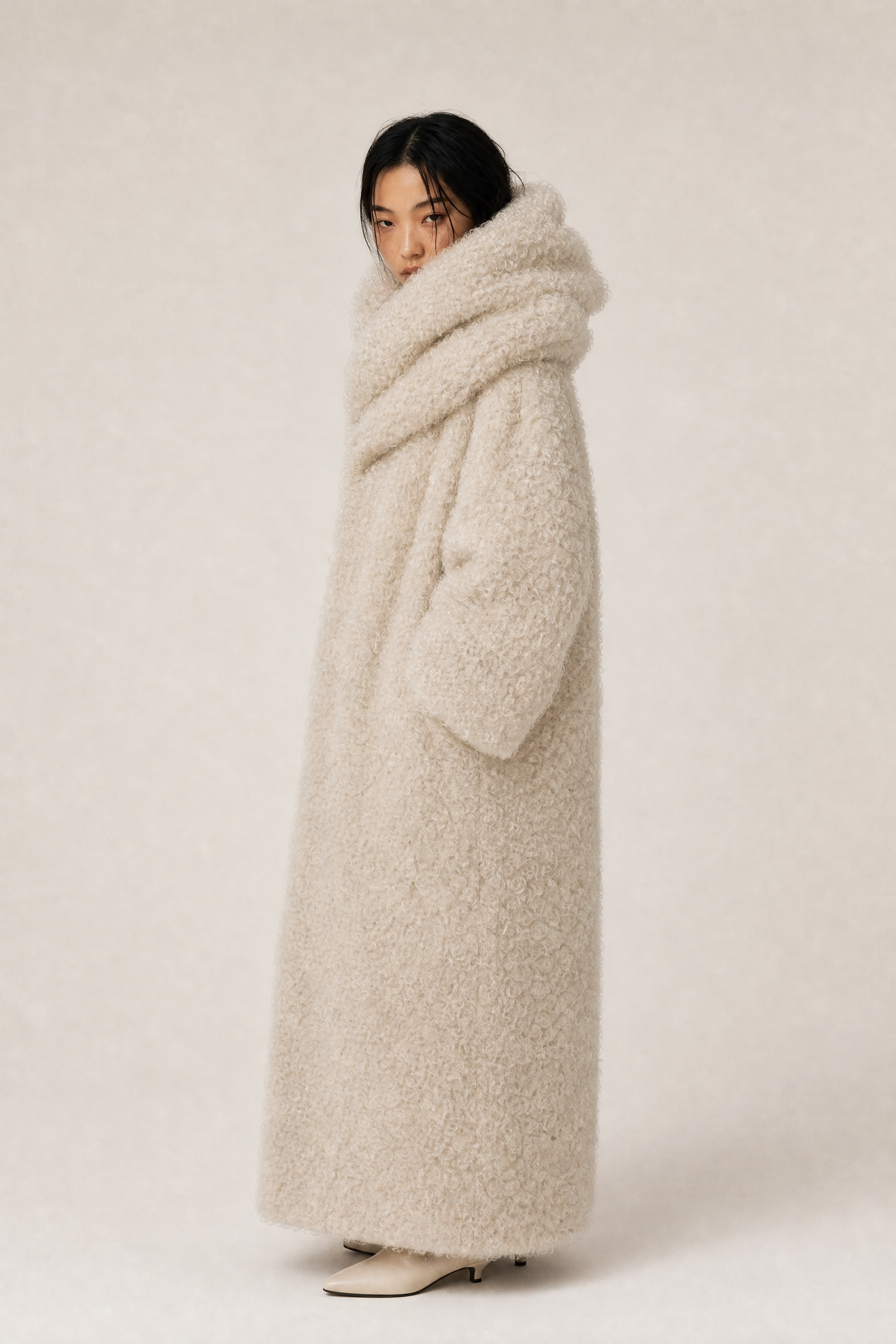 Cream coat model shot, side pose